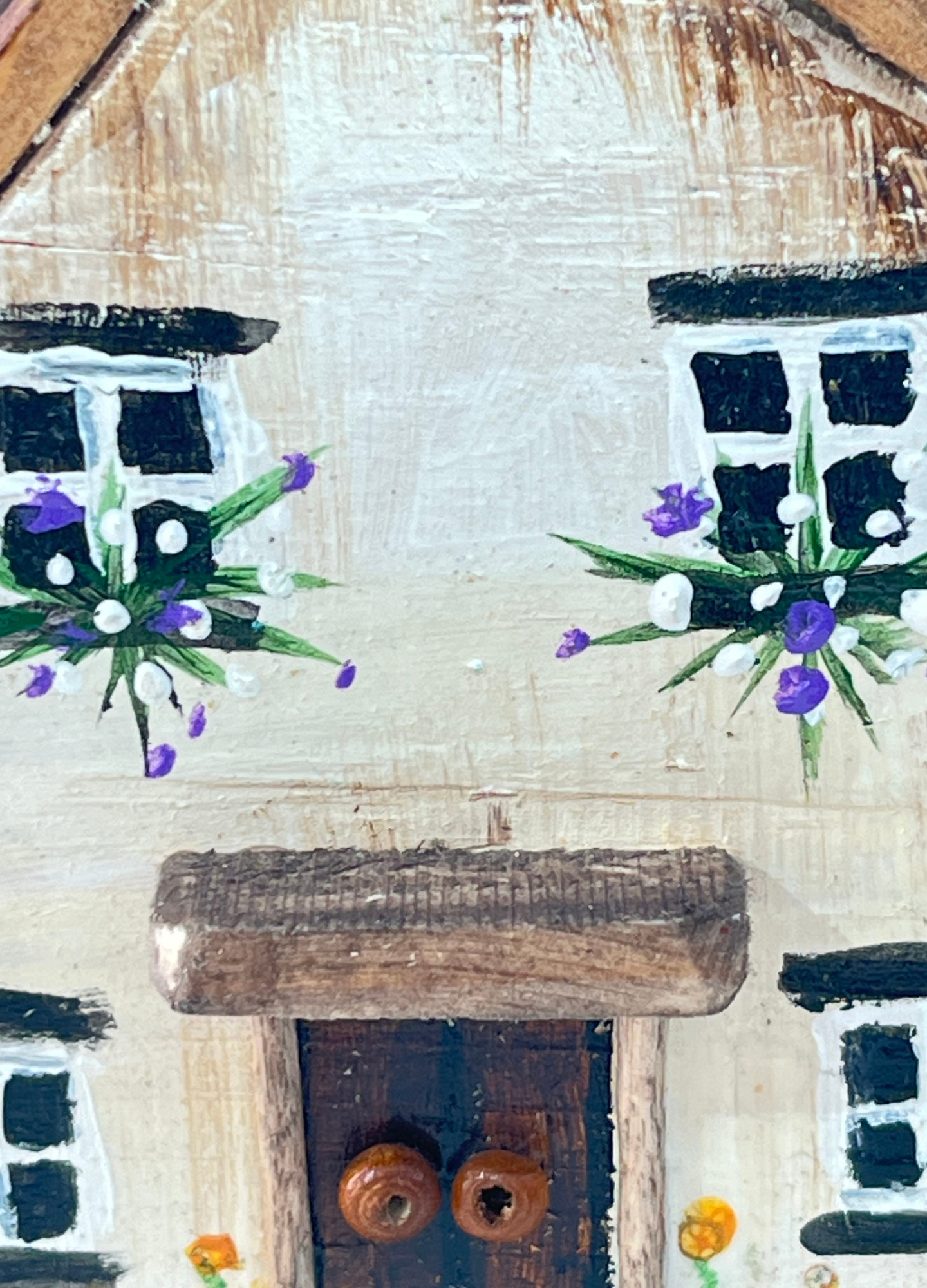Miniature diorama with a house, and plants on a white background (RRH1050)