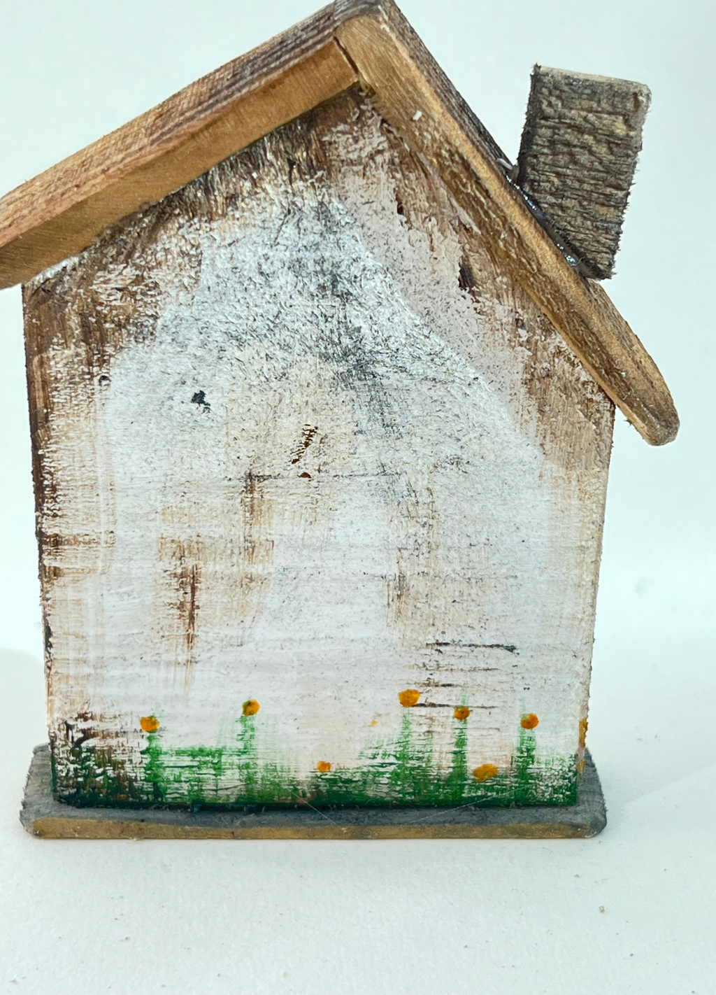 Miniature diorama with a house, and plants on a white background (RRH1050)