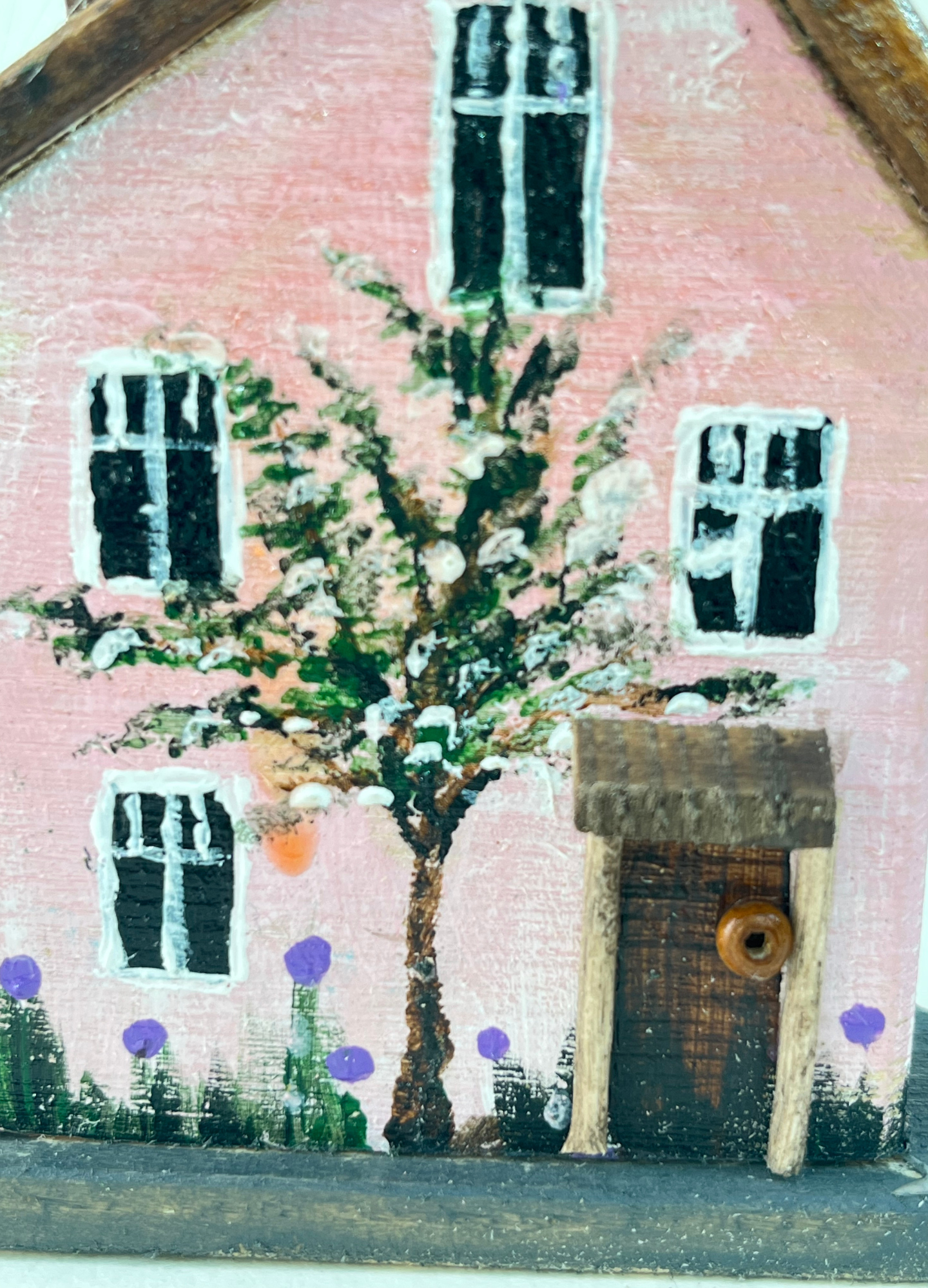 Miniature diorama with a house, and plants on a white background (RRH1052)