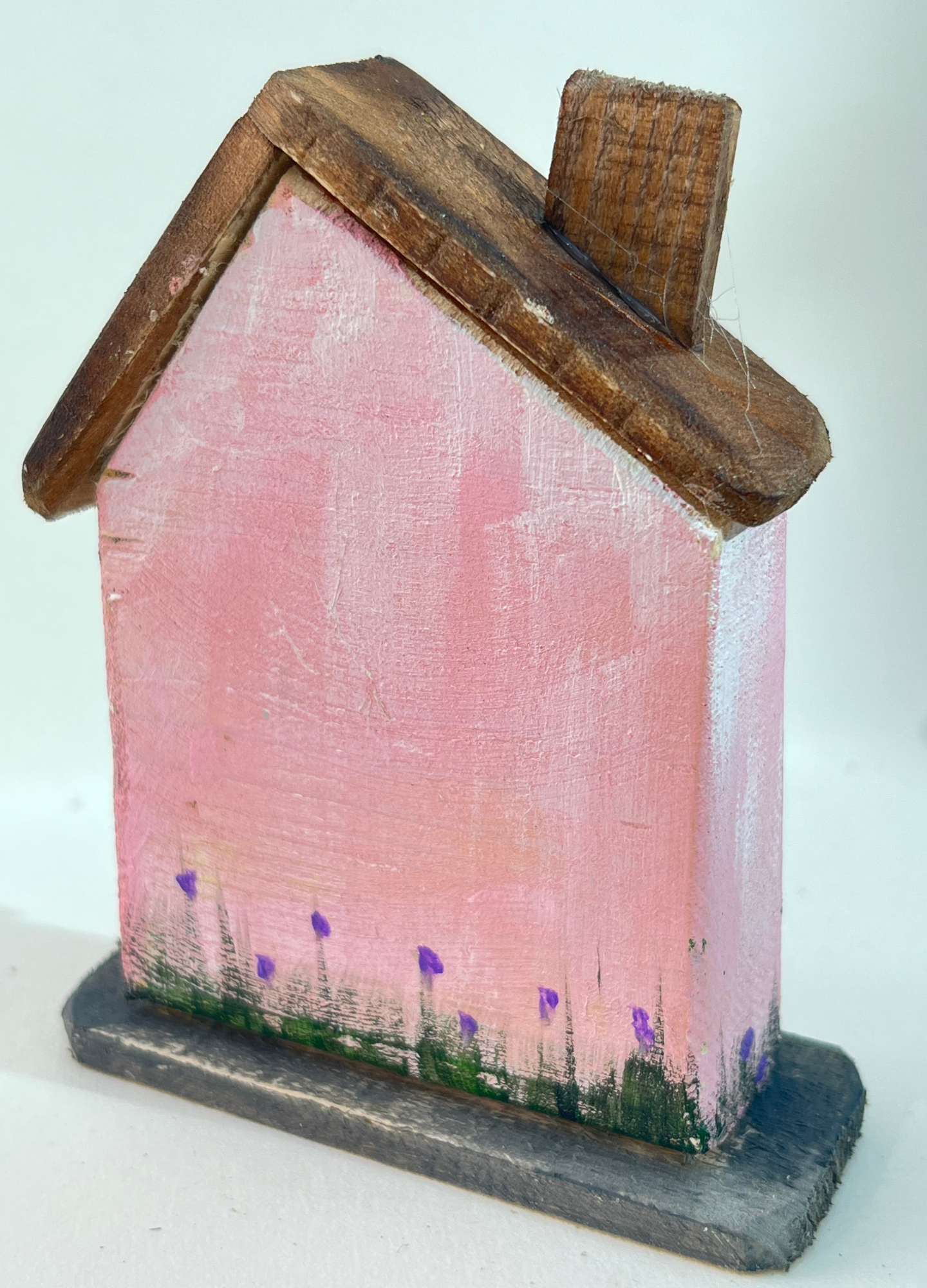 Miniature diorama with a house, and plants on a white background (RRH1052)