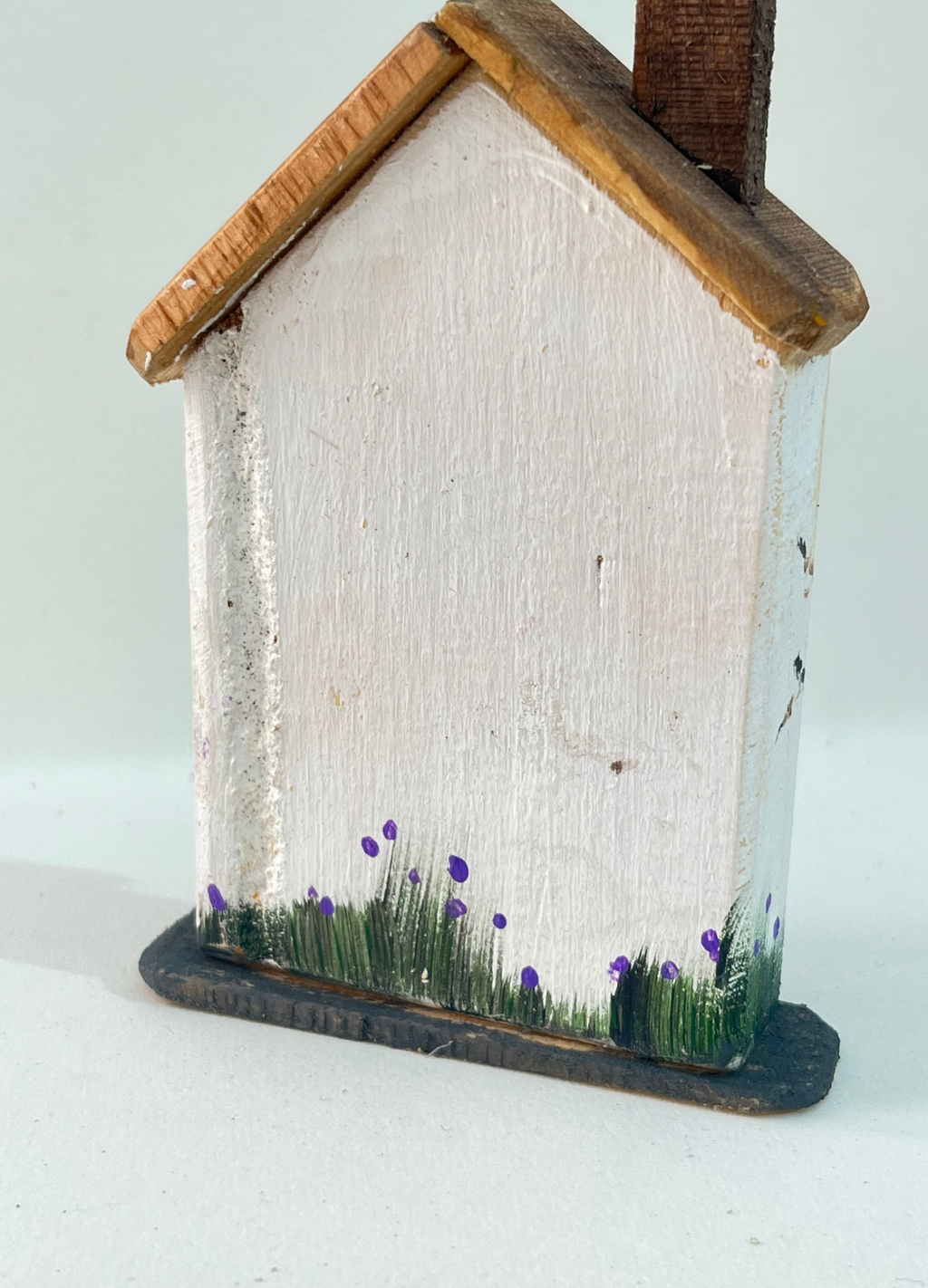 Miniature diorama with a house, and plants on a white background (RRH1053)