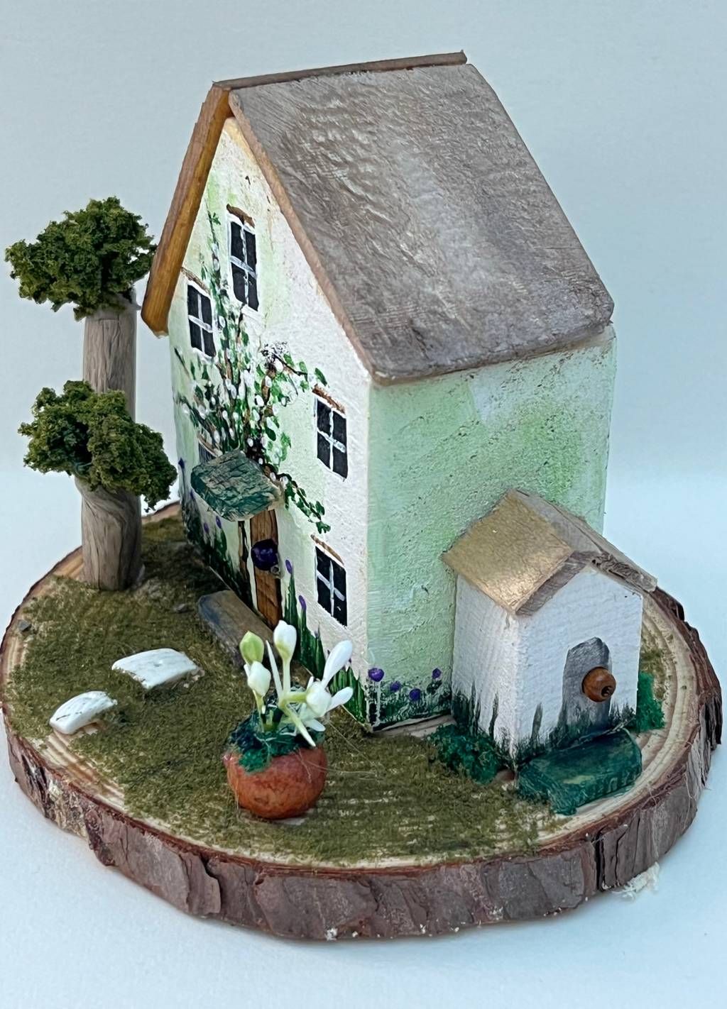 Miniature diorama with a house, and plants on a white background (RRH1040) (Copy)