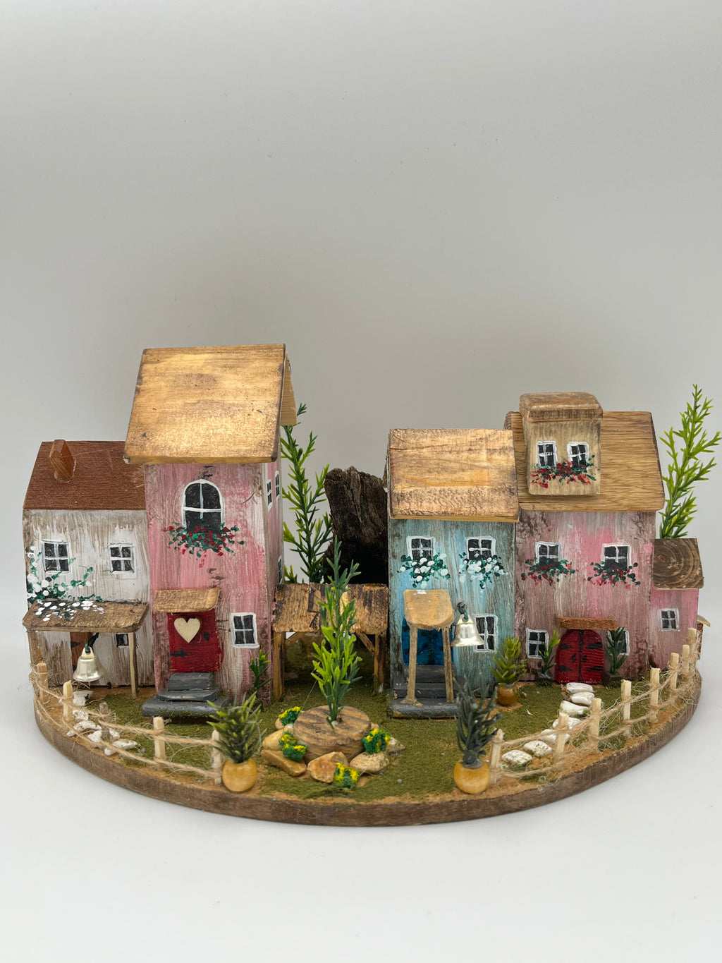 Handcraftedin United Kingdom. Row of Miniature Wooden Houses on Natural Base  RRH1034