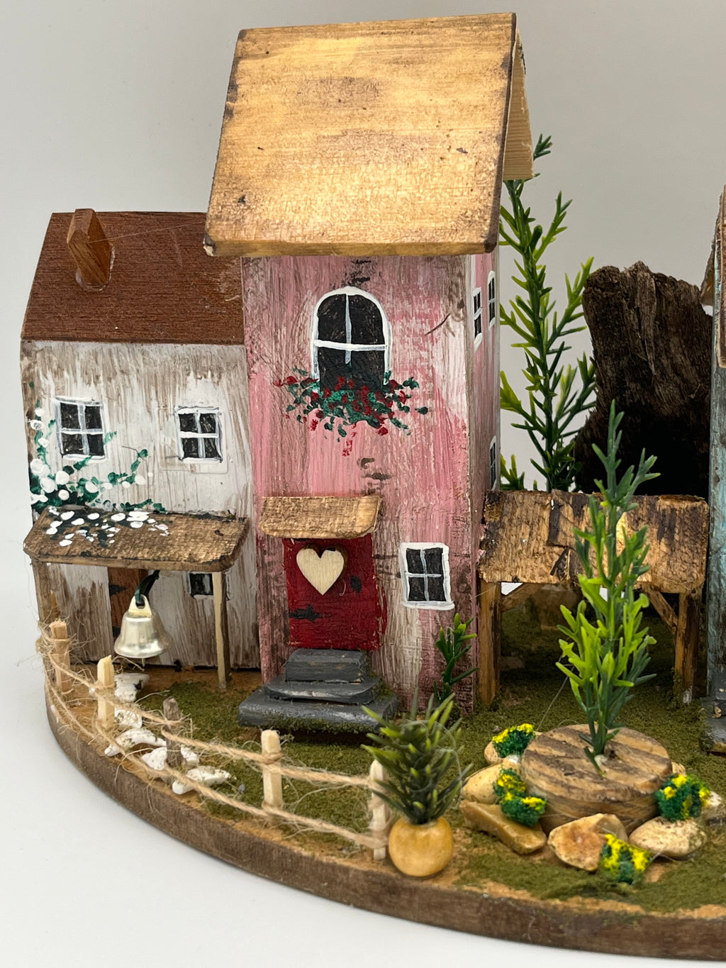 Handcraftedin United Kingdom. Row of Miniature Wooden Houses on Natural Base  RRH1034