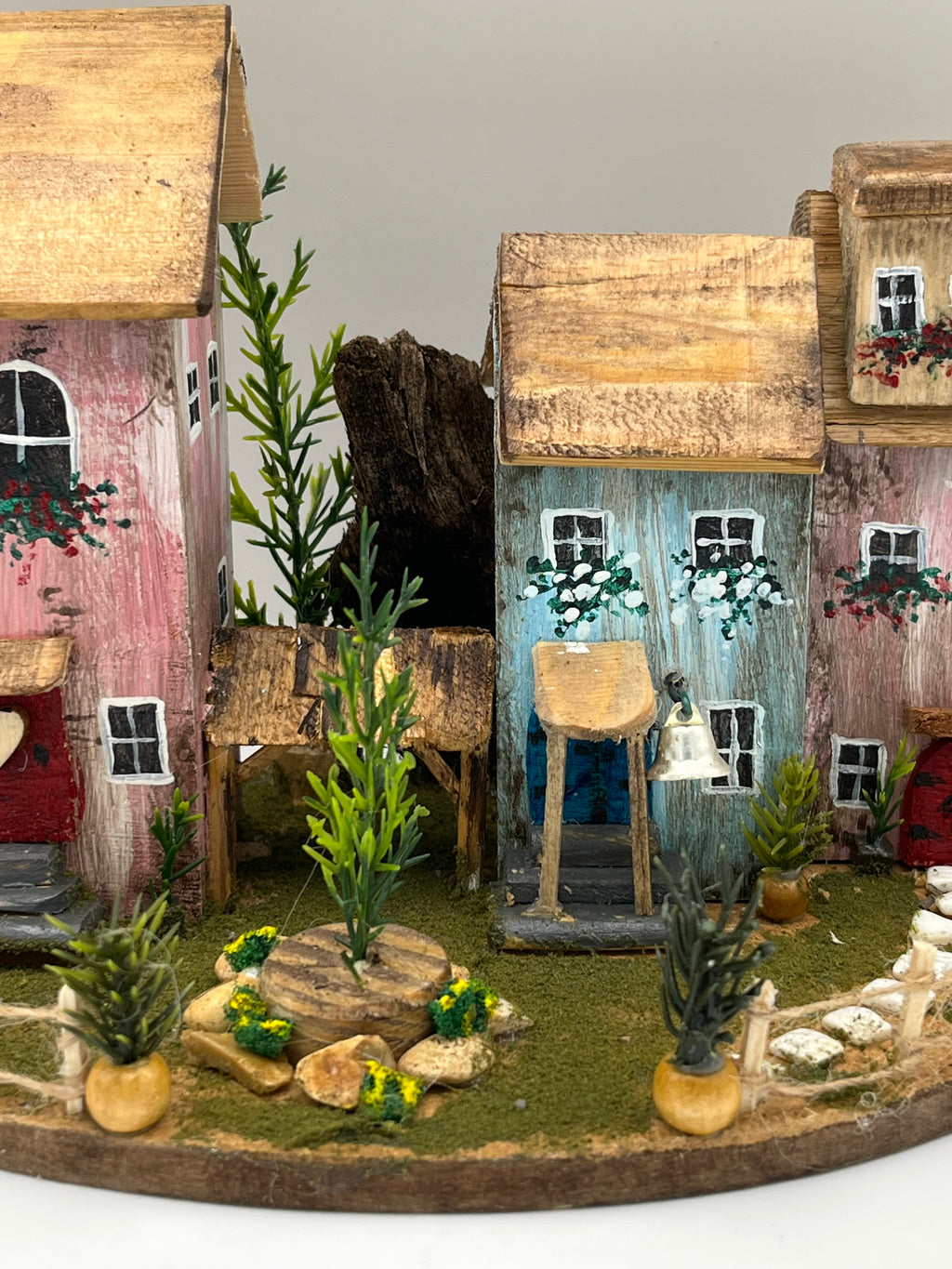 Handcraftedin United Kingdom. Row of Miniature Wooden Houses on Natural Base  RRH1034