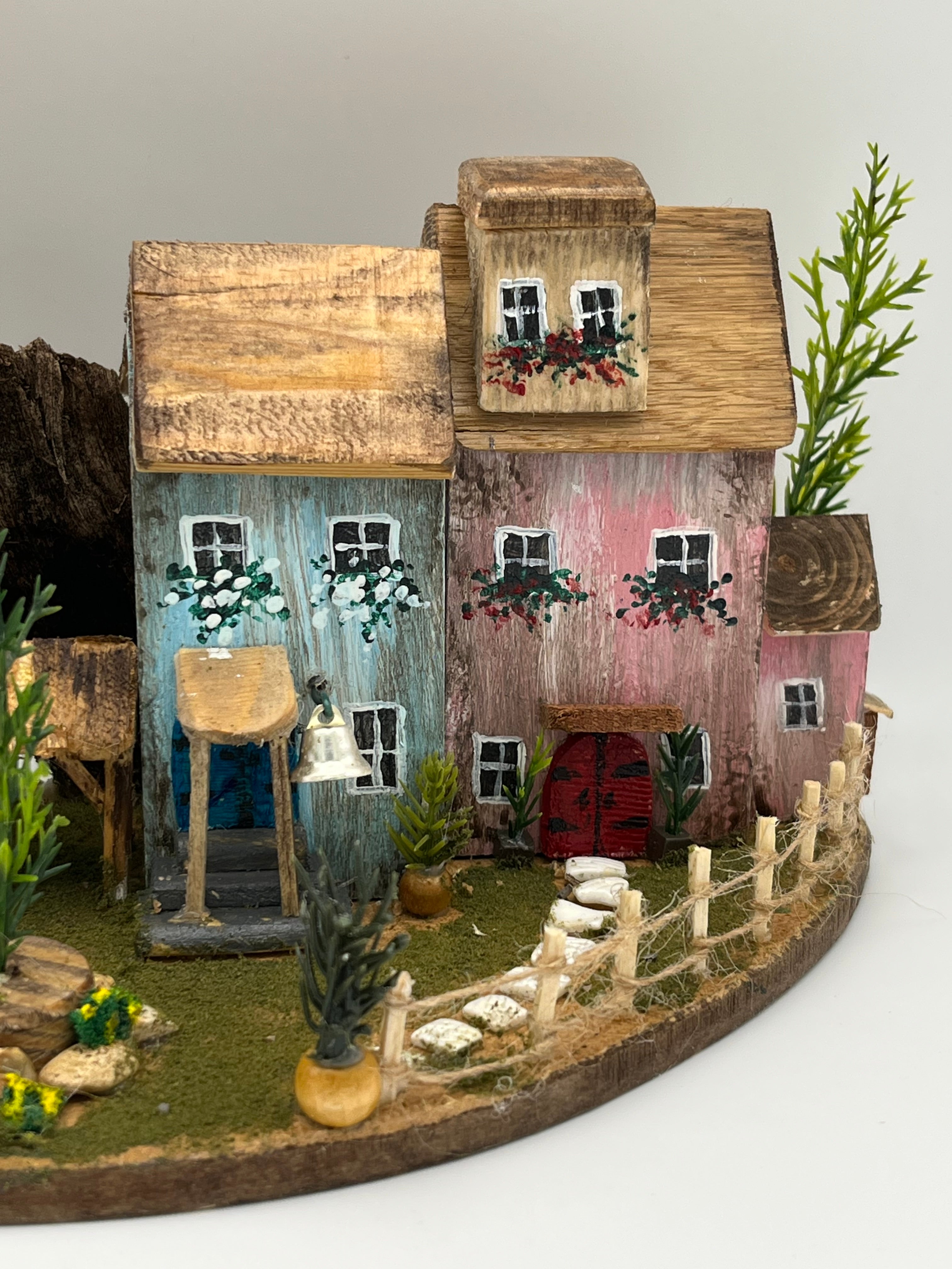 Handcraftedin United Kingdom. Row of Miniature Wooden Houses on Natural Base  RRH1034