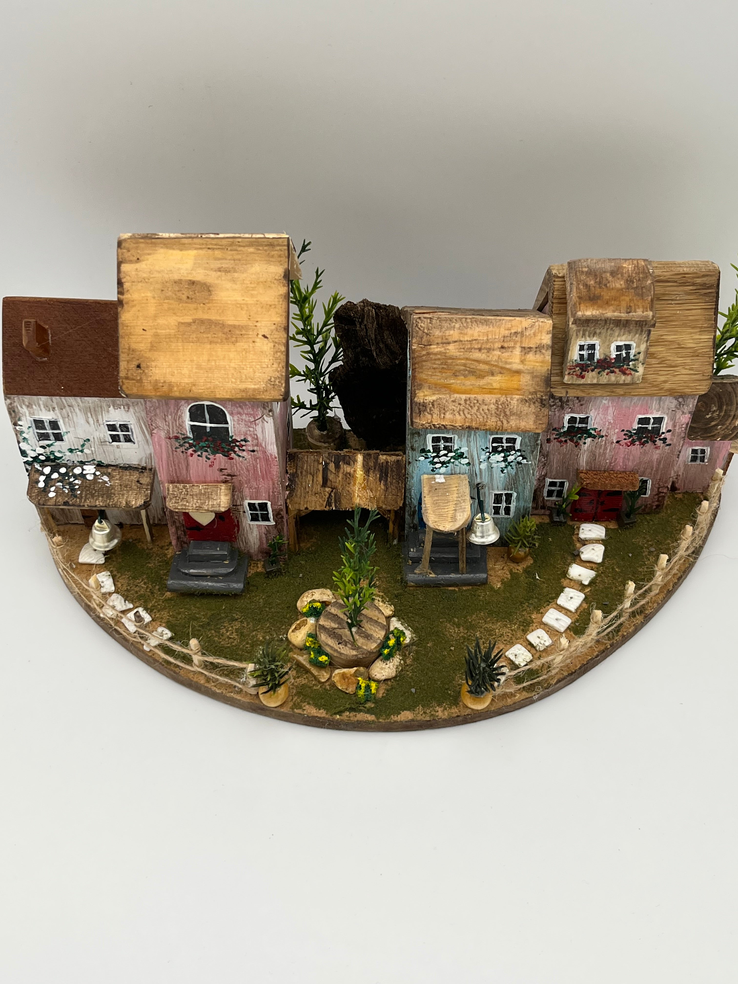Handcraftedin United Kingdom. Row of Miniature Wooden Houses on Natural Base  RRH1034