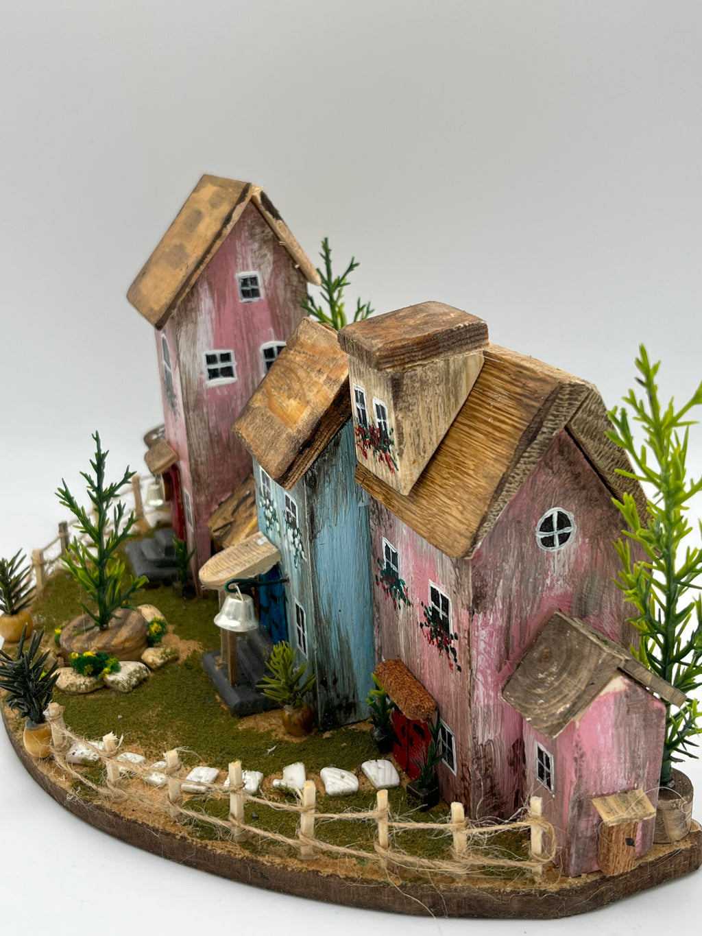 Handcraftedin United Kingdom. Row of Miniature Wooden Houses on Natural Base  RRH1034