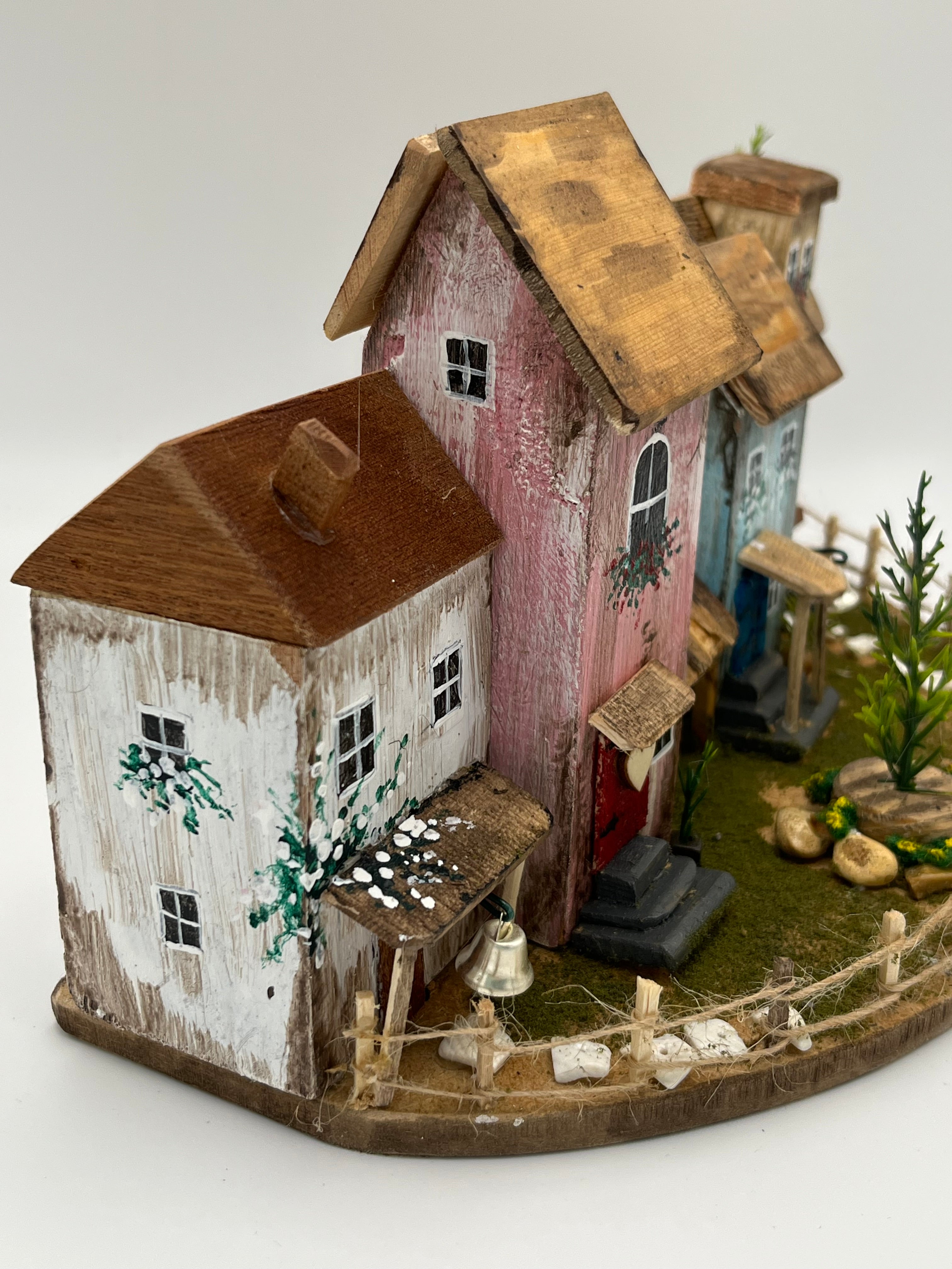 Handcraftedin United Kingdom. Row of Miniature Wooden Houses on Natural Base  RRH1034