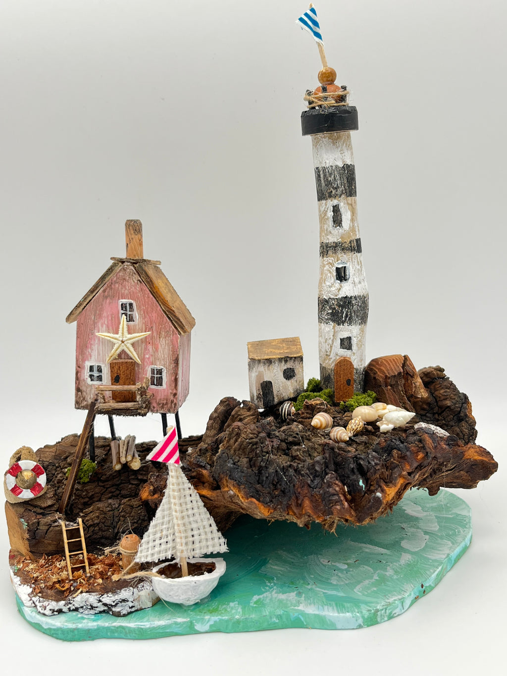Miniature House and Lighthouse out at Sea  RRS1008