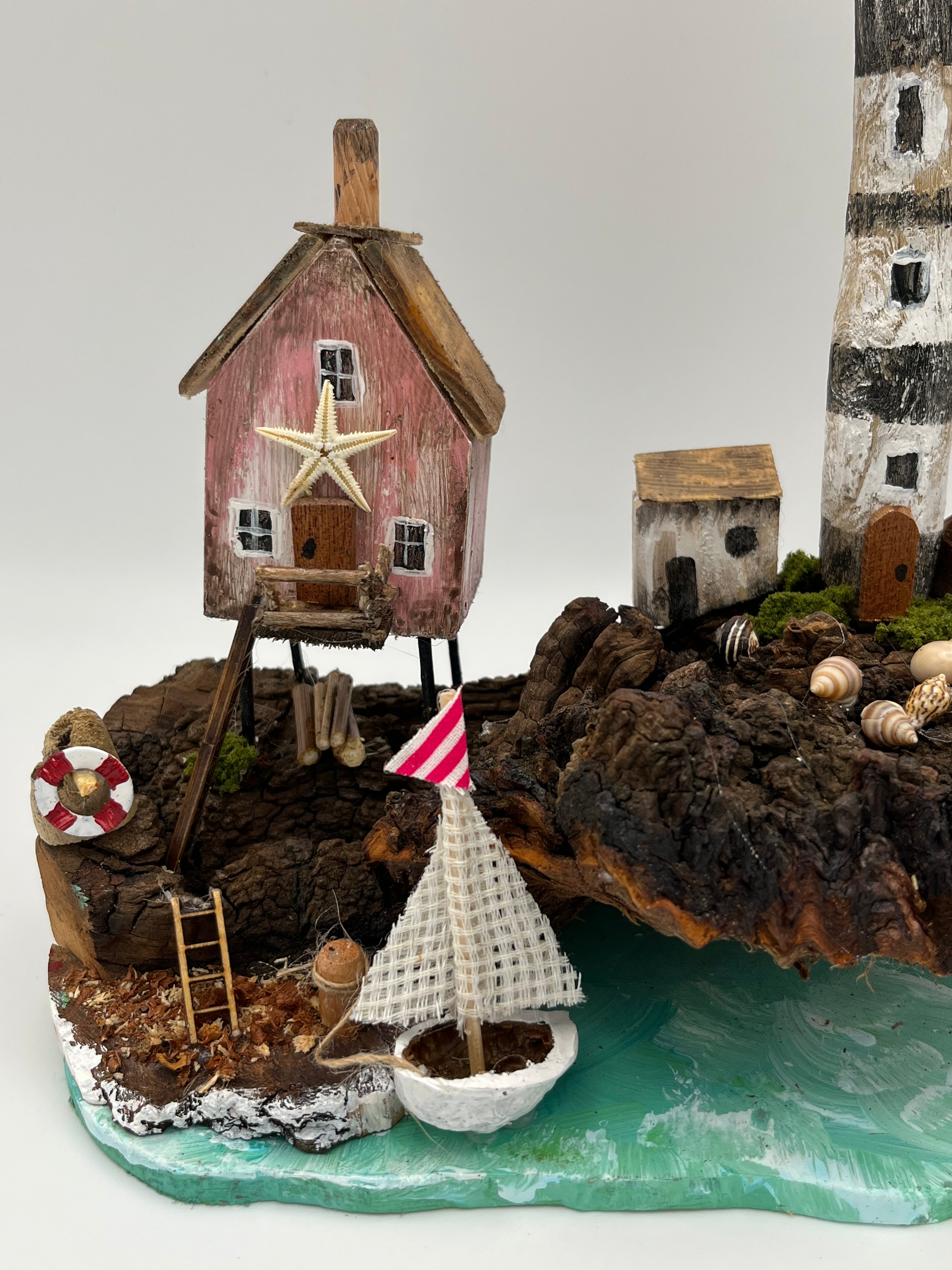 Miniature House and Lighthouse out at Sea  RRS1008