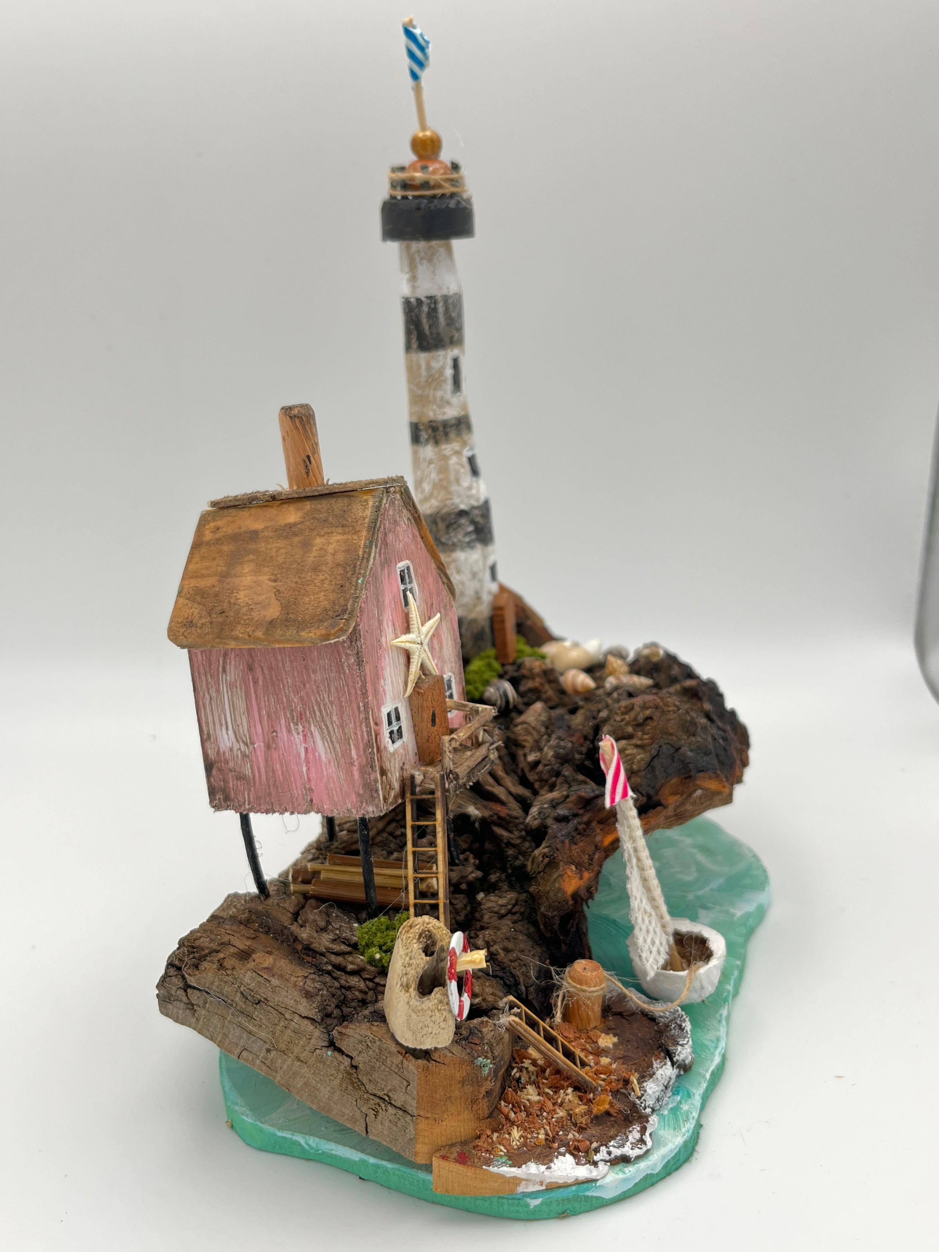 Miniature House and Lighthouse out at Sea  RRS1008