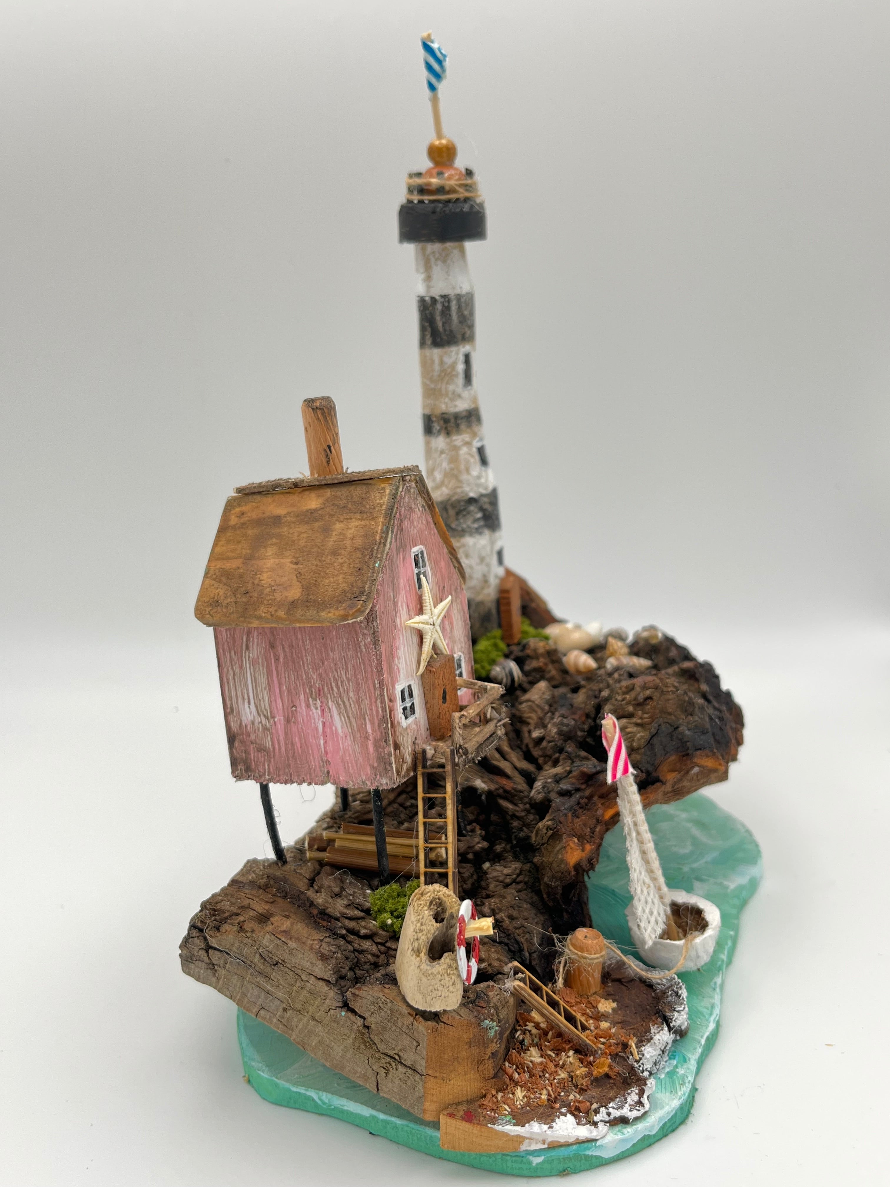 Miniature House and Lighthouse out at Sea  RRS1008