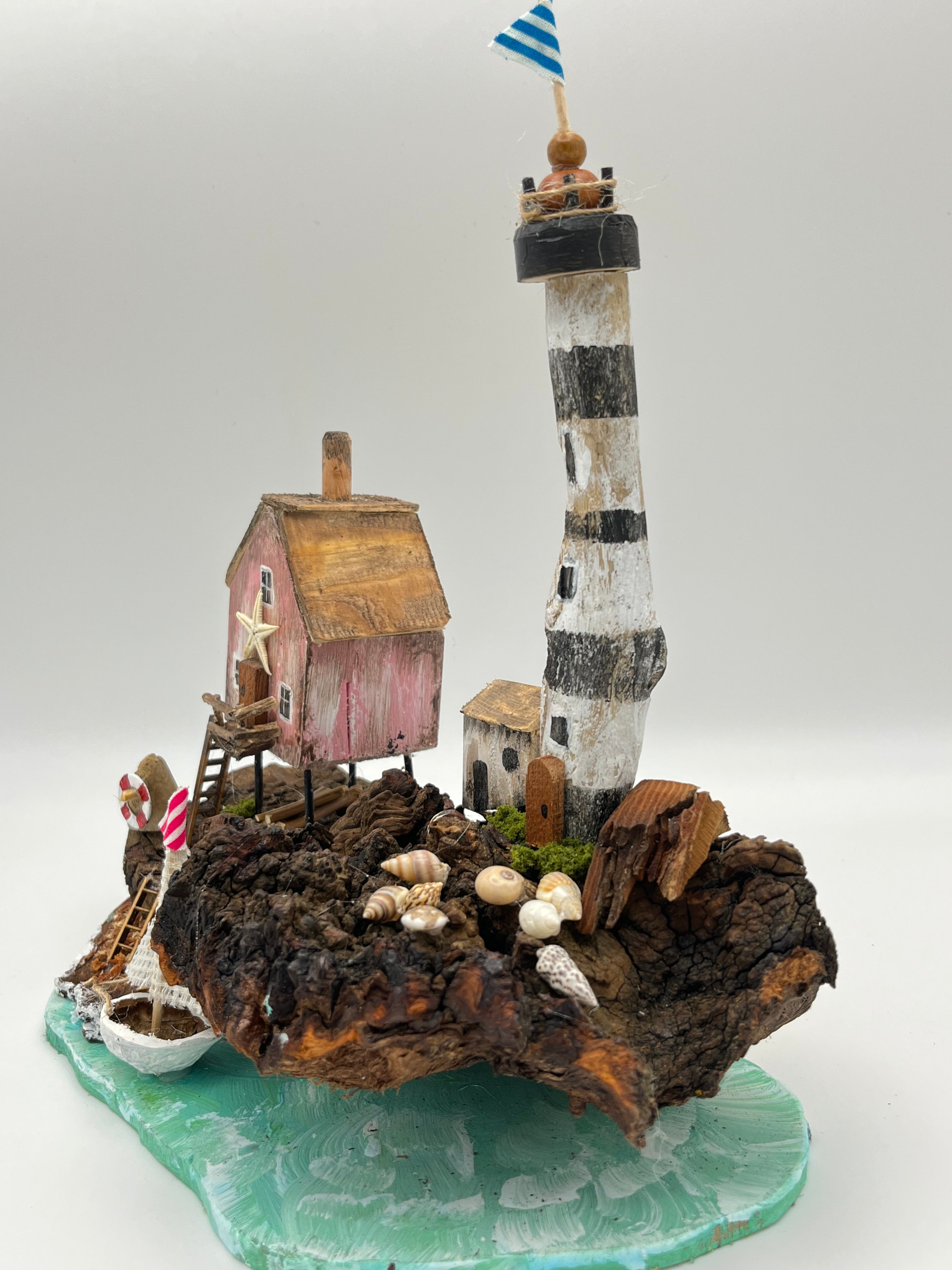 Miniature House and Lighthouse out at Sea  RRS1008