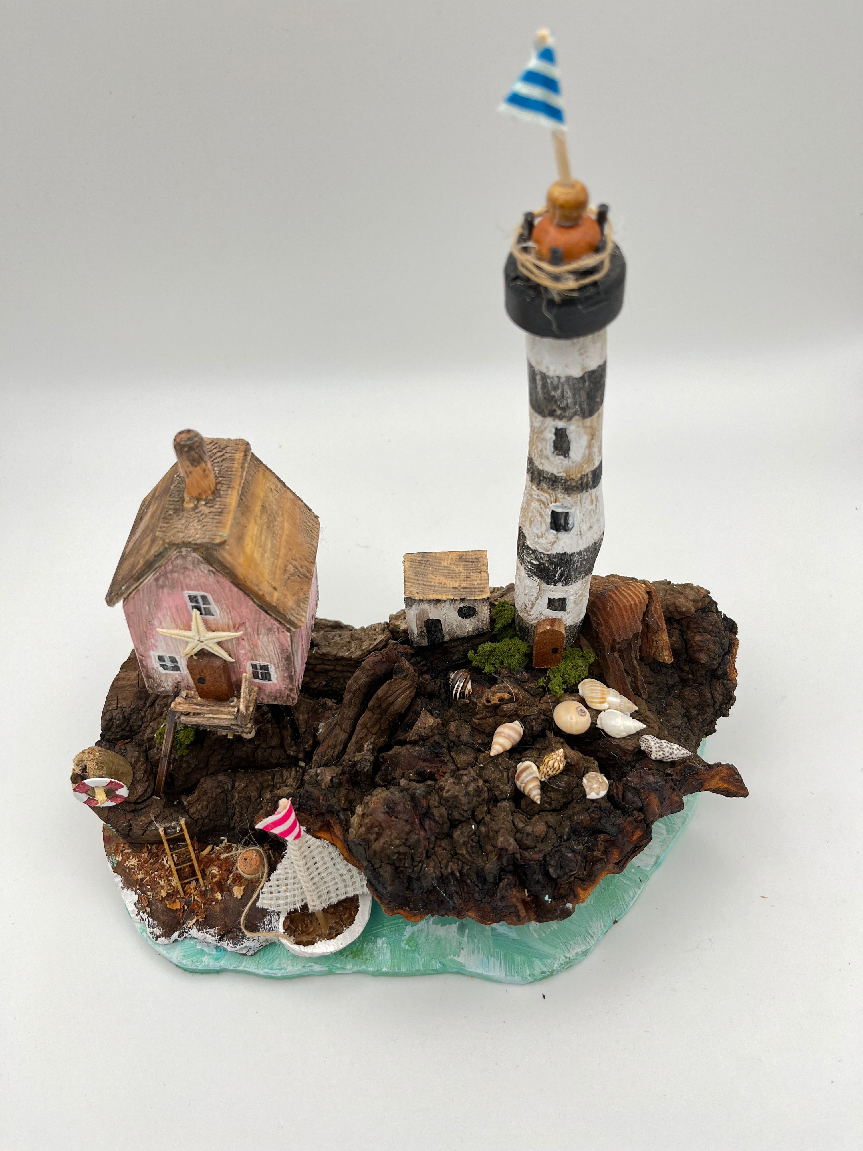 Miniature House and Lighthouse out at Sea  RRS1008