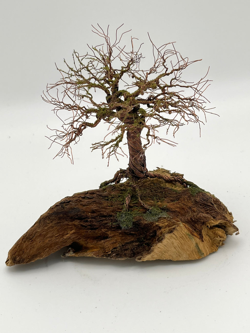 Single Handcrafted miniature copper wire tree by the water on natural bark (RRT010)