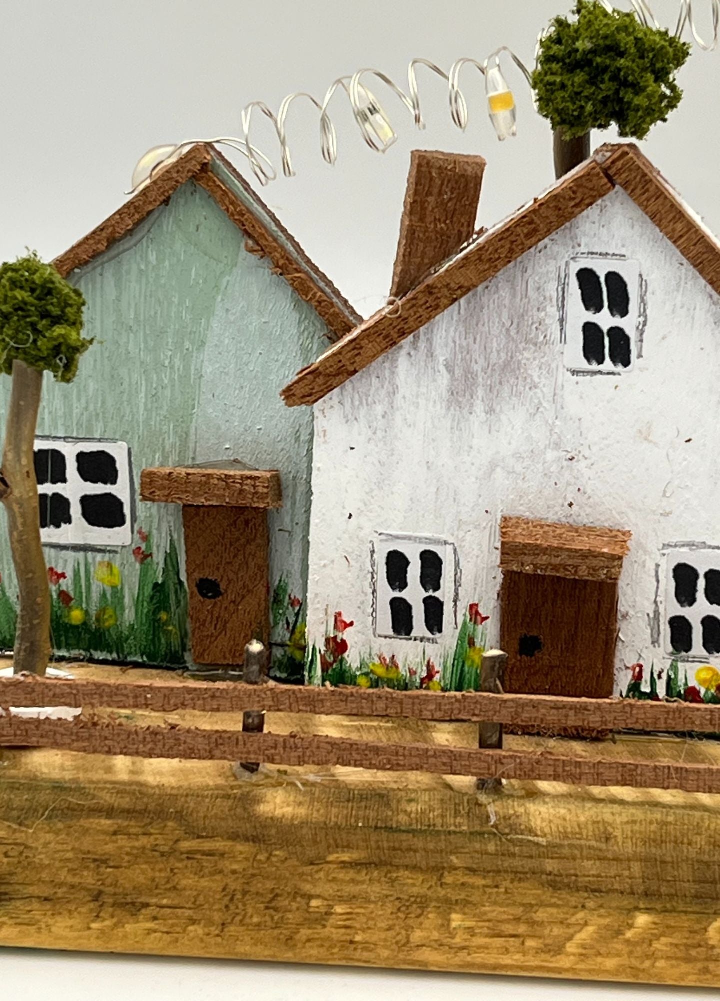 Handcrafted Miniature Wooden Houses on Natural Base with led lights RR1011