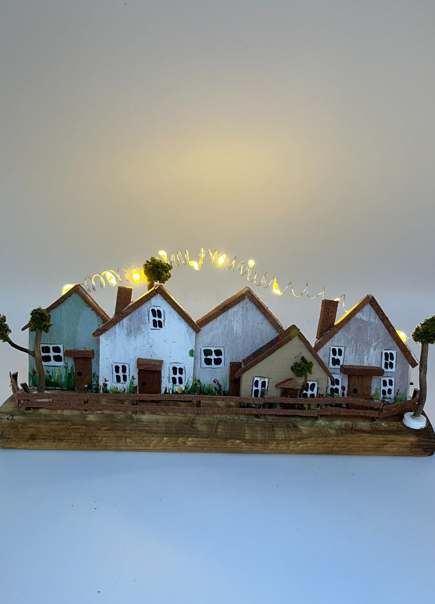 Handcrafted Miniature Wooden Houses on Natural Base with led lights RR1011