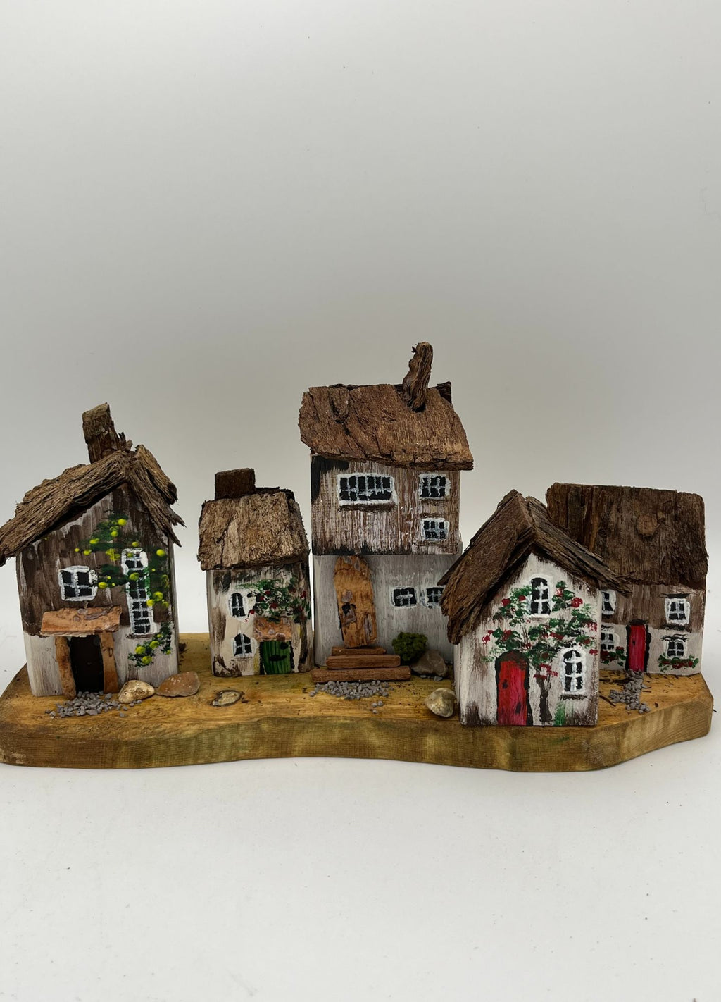 Five Handcrafted Miniature Wooden houses on natural wooden base RRH1028