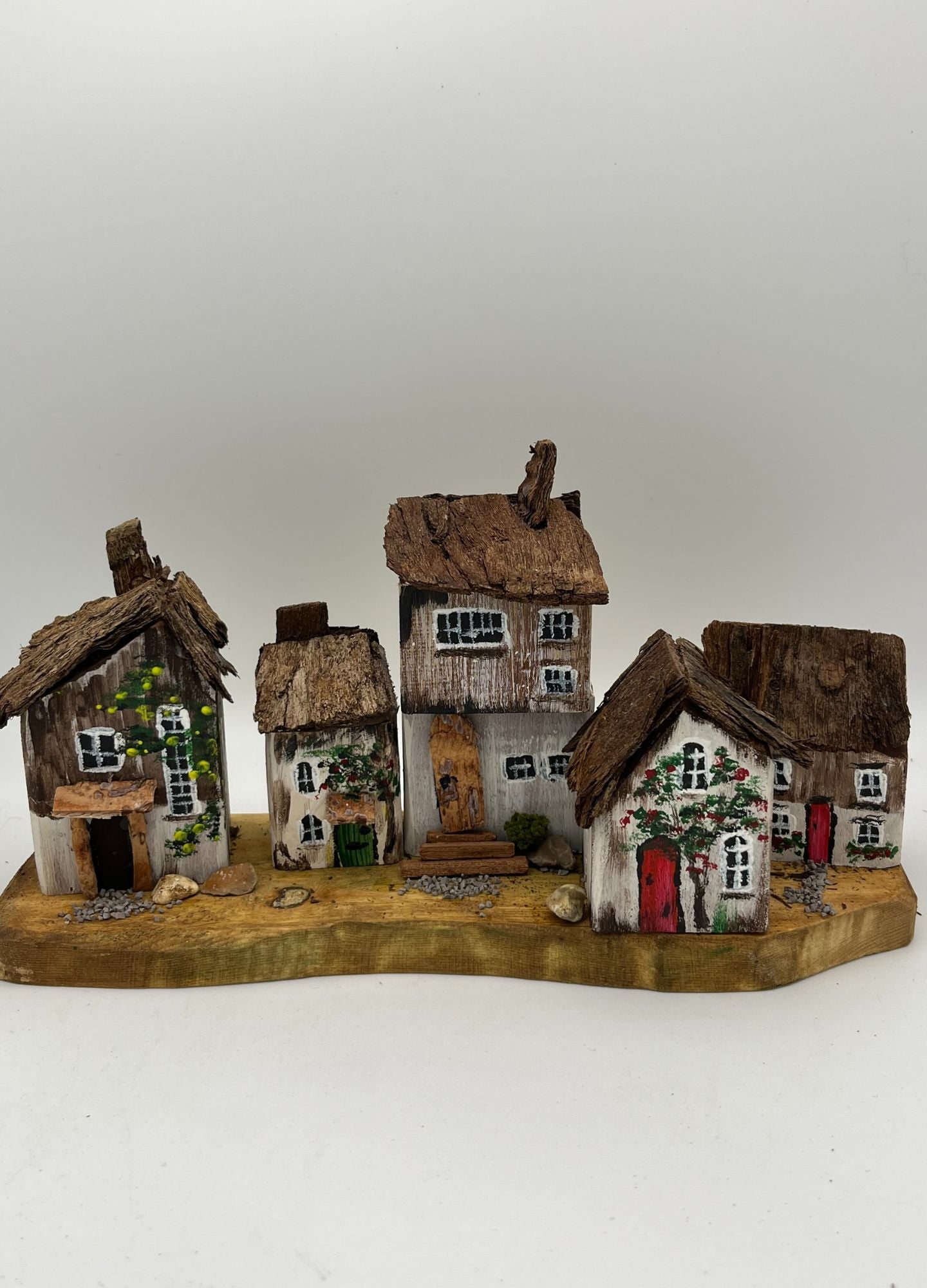 Five Handcrafted Miniature Wooden houses on natural wooden base RRH1028