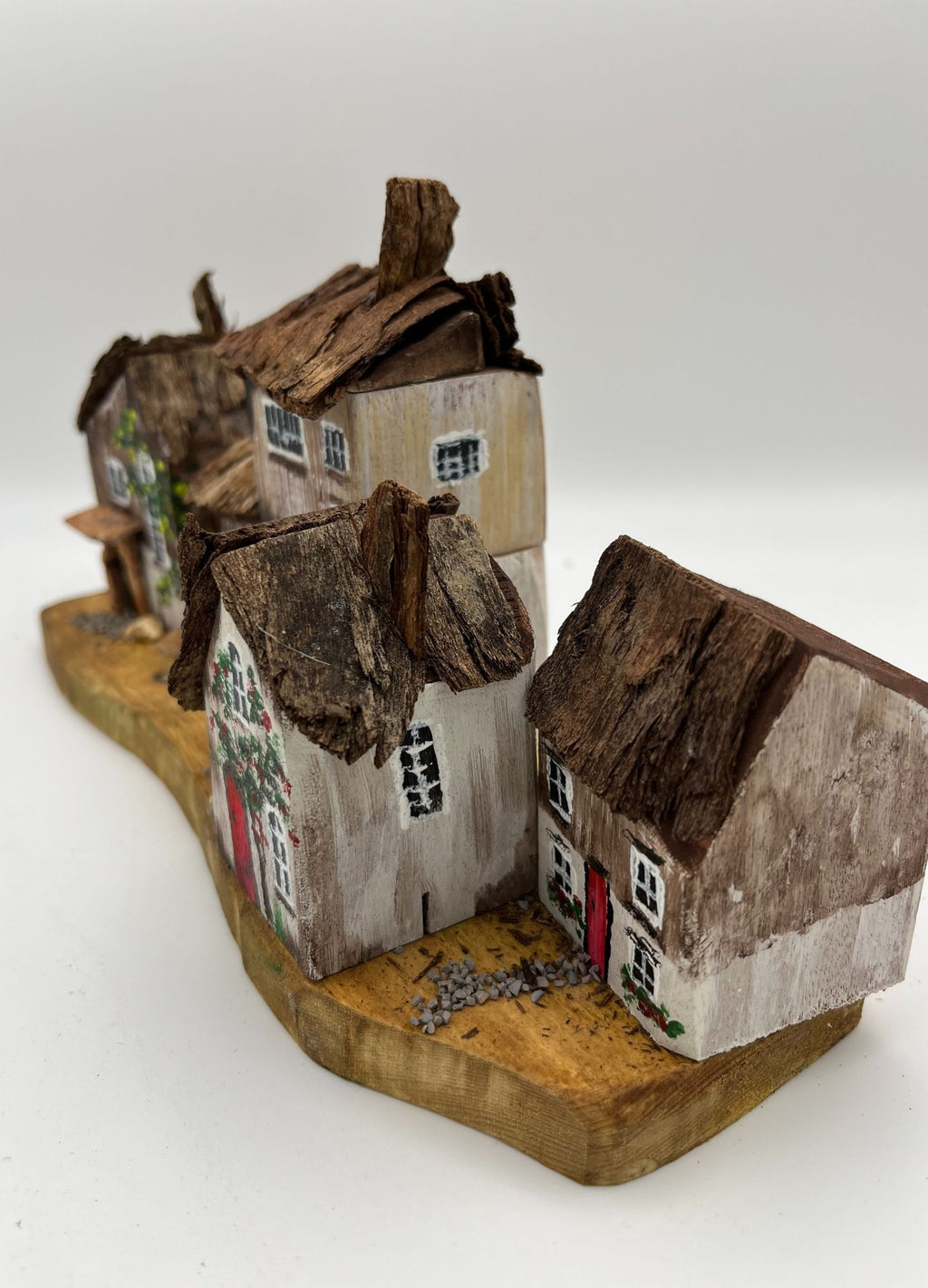 Five Handcrafted Miniature Wooden houses on natural wooden base RRH1028