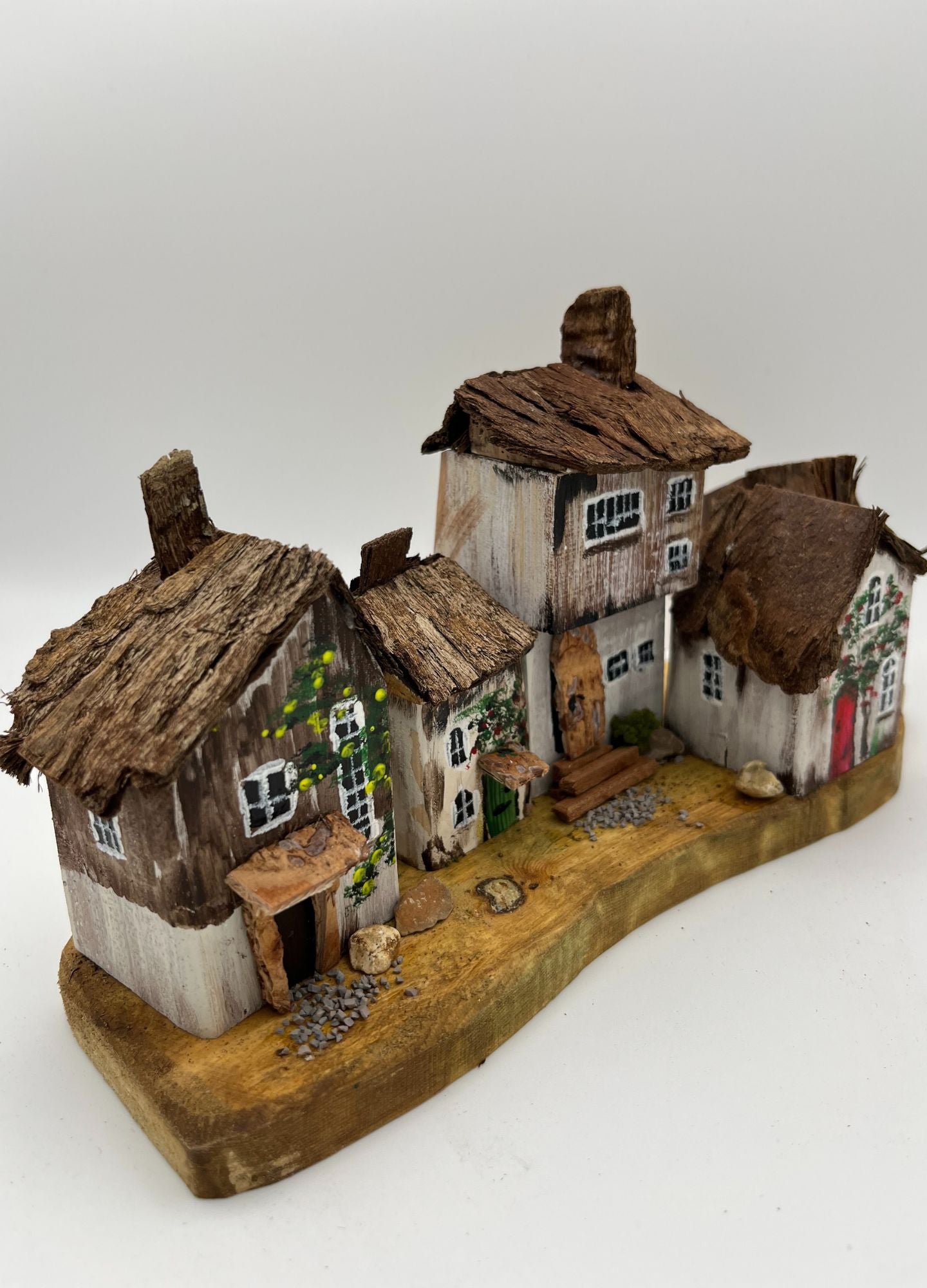 Five Handcrafted Miniature Wooden houses on natural wooden base RRH1028